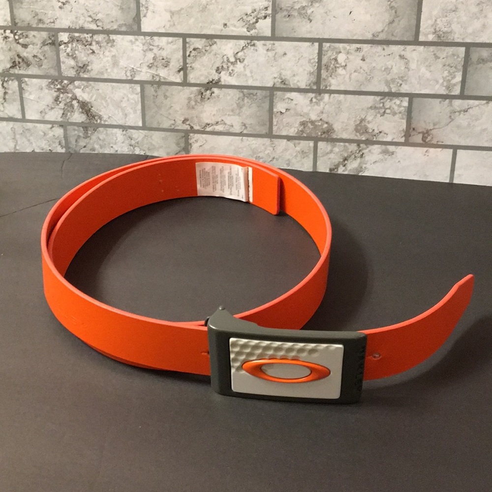 Oakley orange leather belt. Approximately 50” long